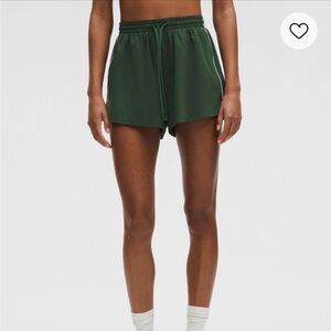 Green Athletic Shorts with White Trim
